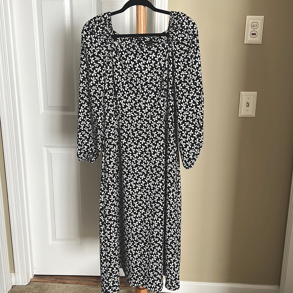 Perfect for the holidays! This midi dress has an A-line shape. Like new.